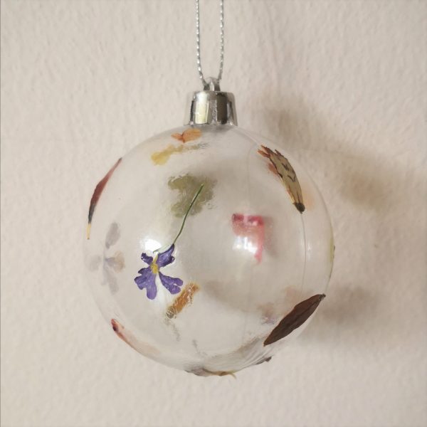 Clear bauble decorated with pressed flowers